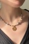 naszyjnik z kryształu górskiego, naszyjnik z labradorytu, biżuteria handmade, unikatowy naszyjnik, symbol spirali, elegancka biżuteria ze stali