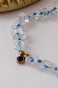 Naszyjnik Lulobelia nr 244, złota oprawa z chabrowym kryształkiem, przejrzysty kryształ górski, biżuteria symboliczna handmade Polska